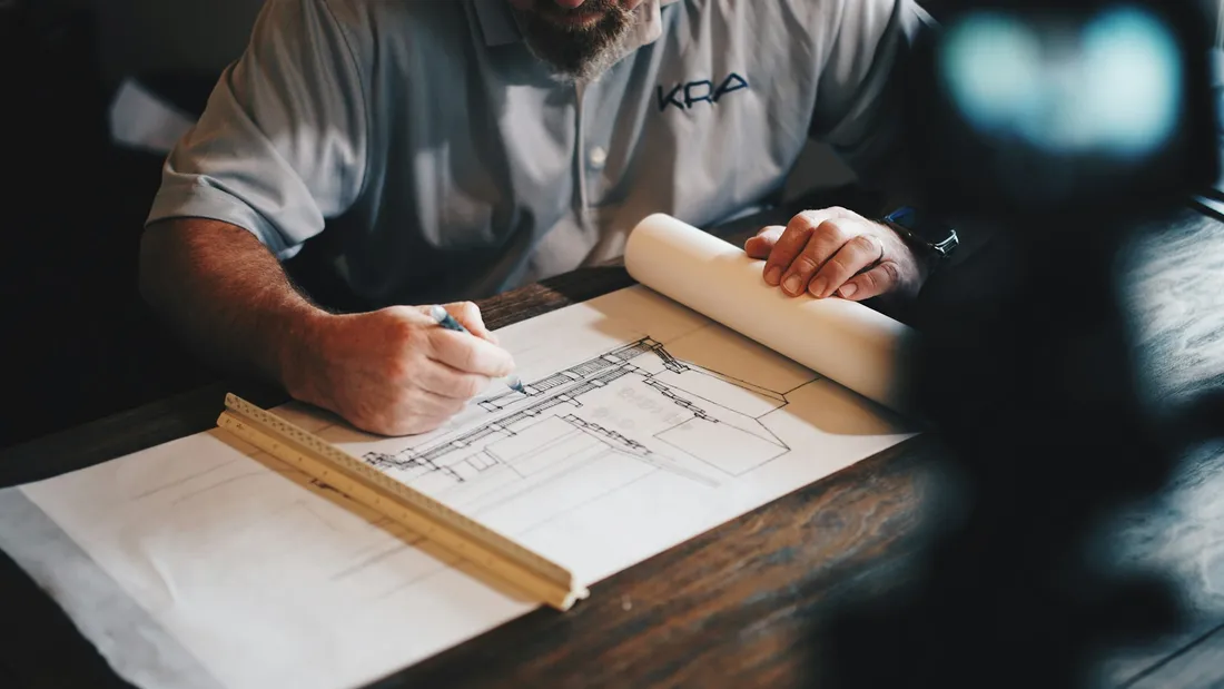 An engineer reviewing construction drawings